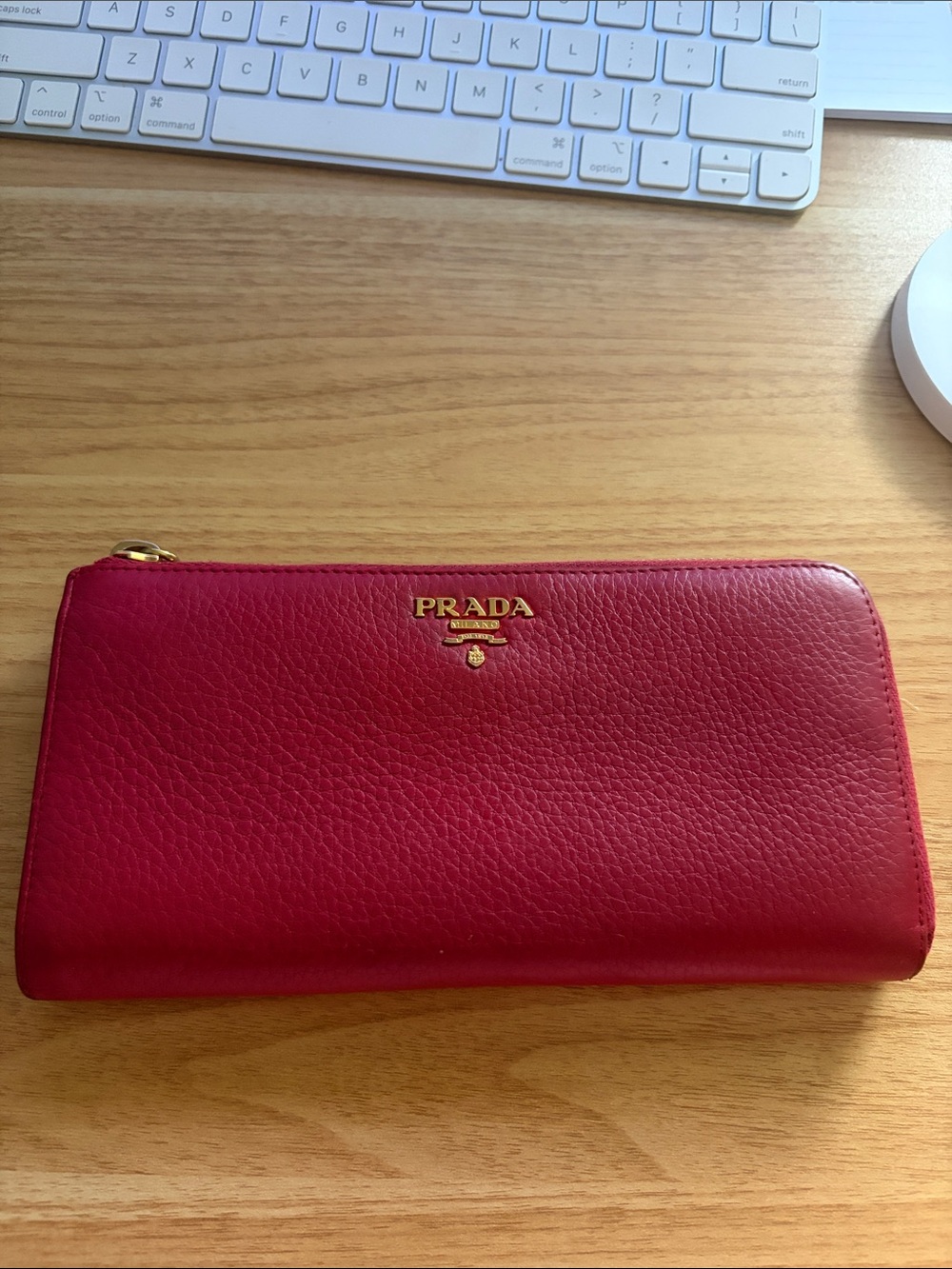 Prada Pebbled Leather Zip Wallet in Deep Red with Gold Logo